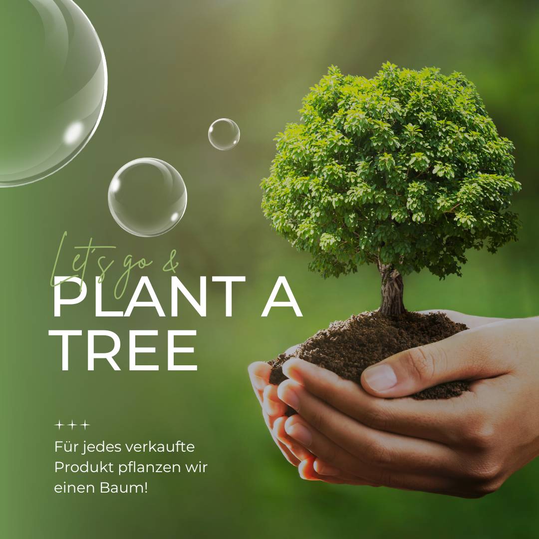 Hände die einen Baum pflanzen